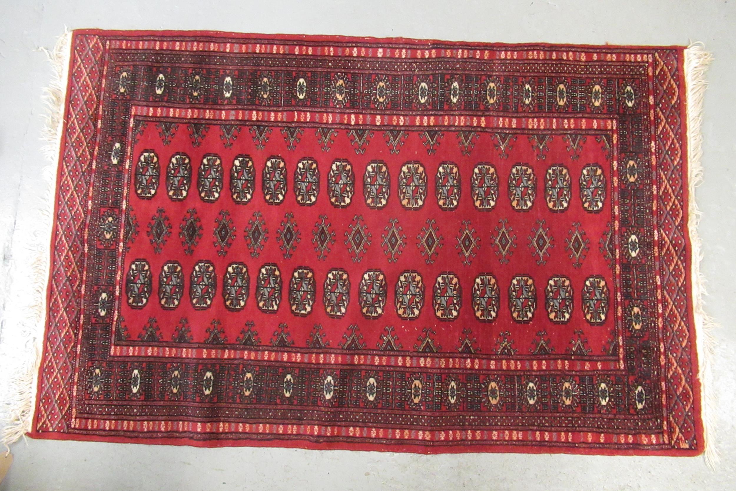Small Tekke rug with three rows of seven gols on a wine ground (borders reduced) - Image 2 of 2