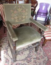 Pair of oak Cromwellian style open arm chairs with green embroidered backs