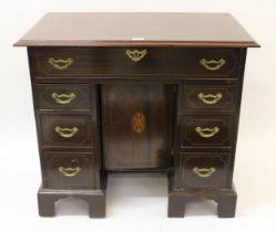 19th / early 20th Century mahogany crossbanded and line inlaid kneehole desk in George III style,