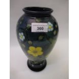 Moorcroft yellow, blue and green buttercup pattern baluster form vase, 25cm high Some crazing to