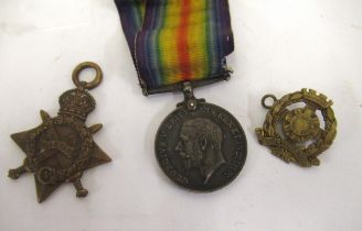 World War I group of two medals, awarded to 42076 GNRM Glynn R.G.A. and a cap badge