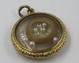 19th Century circular gold photograph locket, later inset with seed pearls and hair 10.5g in weight