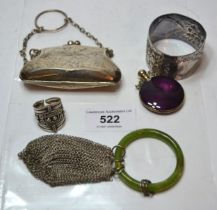 Small silver purse, silver napkin ring, an enamel decorated perfume bottle, silver ring and a wire