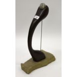 Martin Cundell, carved hardwood sculpture, ' Holding Stone ', circa 1989, on stone base, 45cm