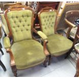 Pair of Victorian marquetry inlaid ladies and gentlemen's library chairs, on turned supports with