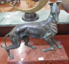 20th Century dark patinated bronze figure of a greyhound on a veined rouge marble base, 43 x 47cm