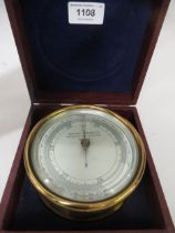 Negretti & Zambra, circular gilt brass cased aneroid barometer inscribed ' Mark I ', together with