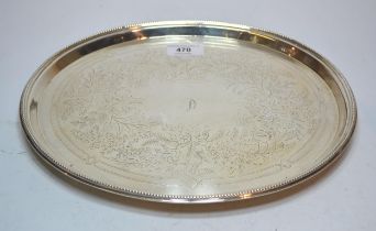 Victorian silver oval floral engraved salver with a bead pattern rim on four bun feet, Sheffield