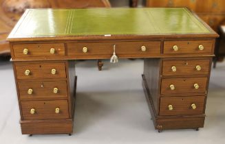 19th Century mahogany twin pedestal desk, with a green tooled leather inset top, above nine pedestal