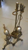 Pair of 20th steel andirons and a matching fireside tool set on stand