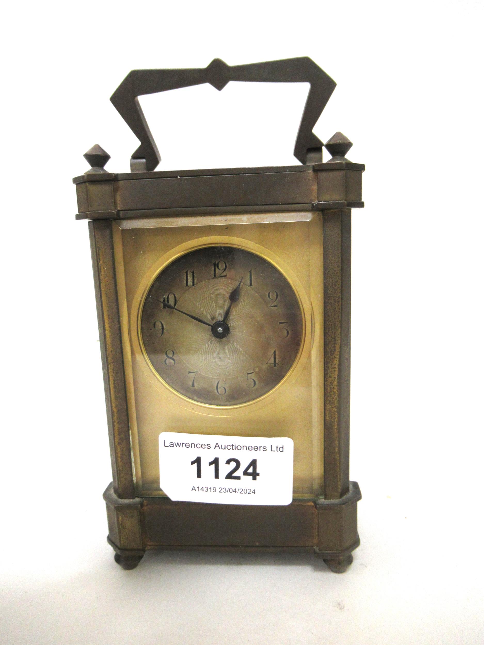 Early 20th Century gilt brass carriage clock, the silvered dial with Arabic numerals, with a