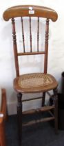 19th Century beechwood correction chair with spindle back and cane seat, together with an oak four