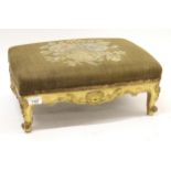 Small Victorian giltwood footstool with floral decorated top on cabriole supports, 44cm wide