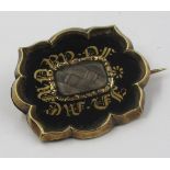 Victorian yellow metal and black enamel hair inset memorial brooch This is not marked, looks to be