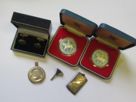 Two silver crowns, silver stamp case, cased pair of silver cufflinks and a silver scent bottle