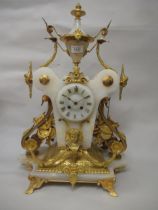19th Century French marble and ormolu mounted mantel clock, decorated with mask heads and musical