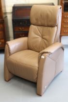 Modern mid tan leather upholstered armchair by Himolla