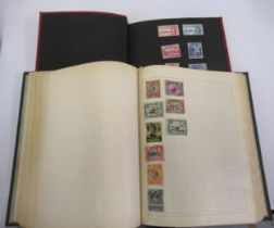 Small red album of mint stamps, ' British Colonies ' and a green album of World stamps