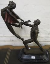 20th Century dark patinated bronze group of male and female dancers on a black flecked marble