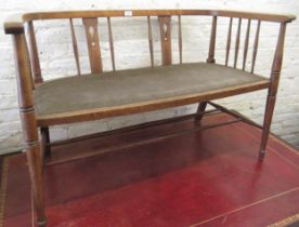 Edwardian beechwood drawing room sofa with a pierced splat and spindle back above a padded seat on