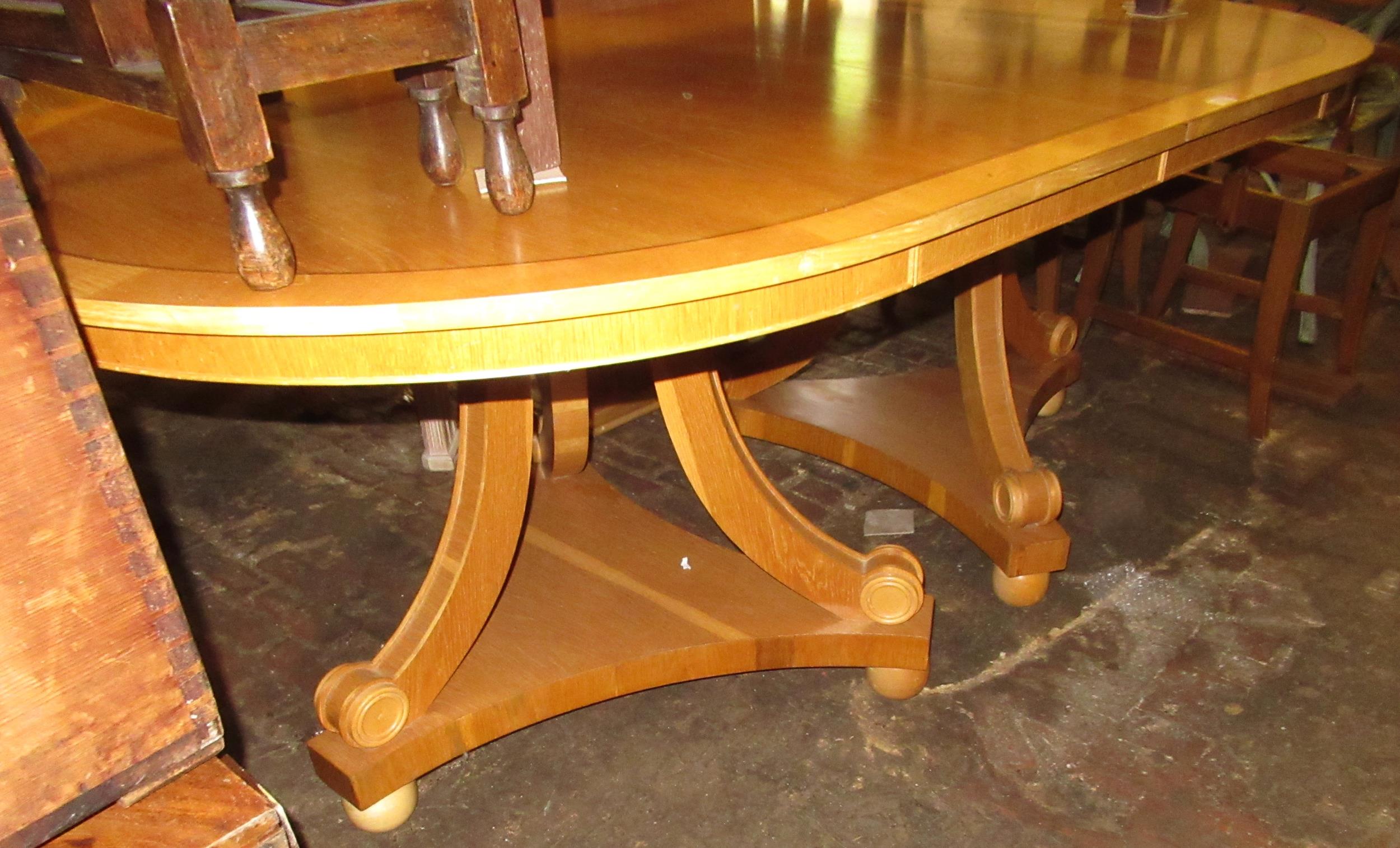 Mid to late 20th Century honey oak and sycamore crossbanded twin pedestal D-end dining table, raised