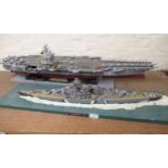 Five large display models of World War II battleships and submarines and an aircraft carrier