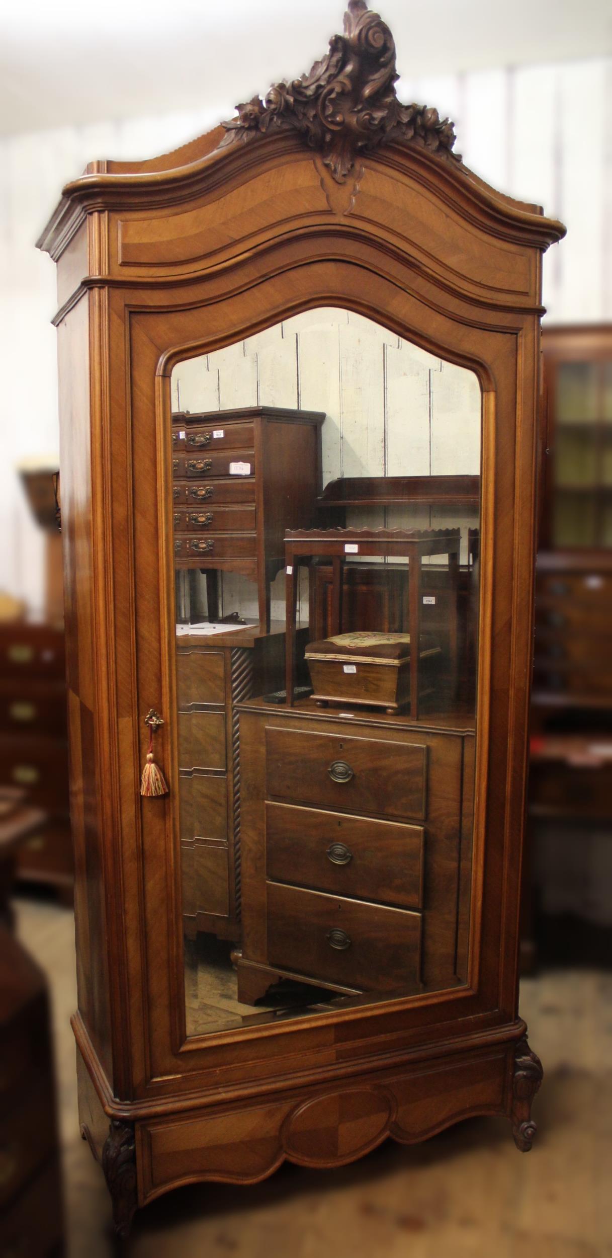 19th Century French walnut double bedstead, together with a matching wardrobe with a floral carved