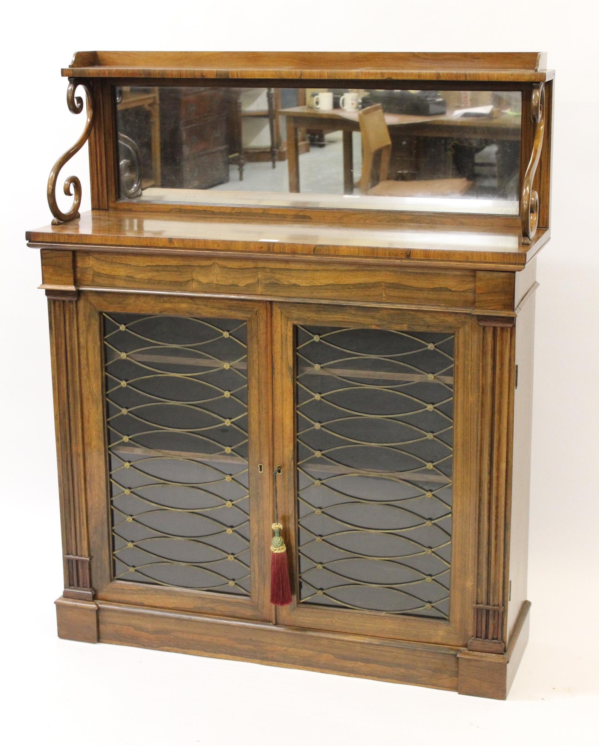 Good Regency rosewood chiffonier, the low mirrored back with scroll supports above a pair of brass