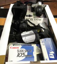 Nikon D40X camera, a Canon EOS 300 camera, together with two camcorders and sundry accessories