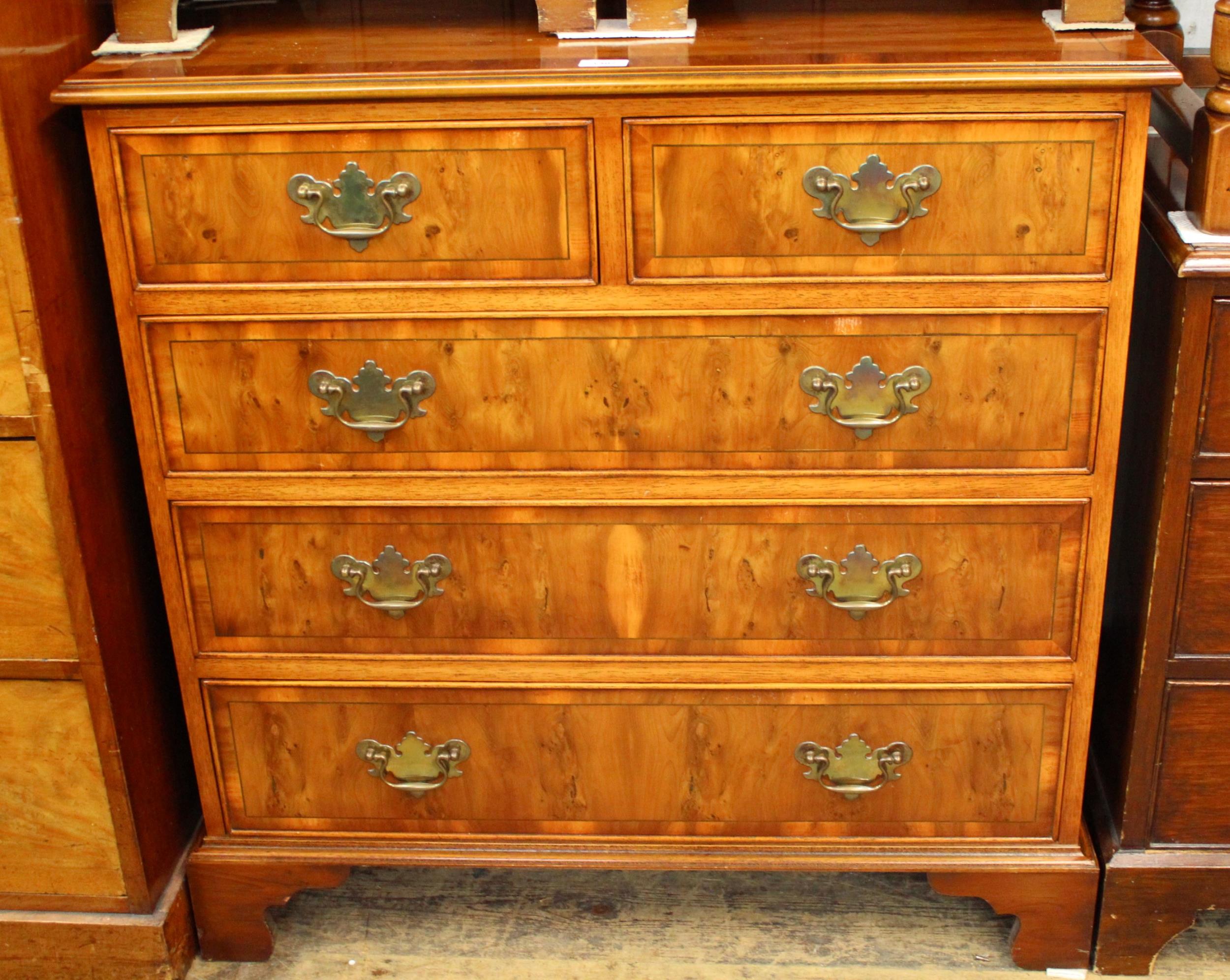 Suite of good quality reproduction yew wood crossbanded line inlaid furniture to include: chest of