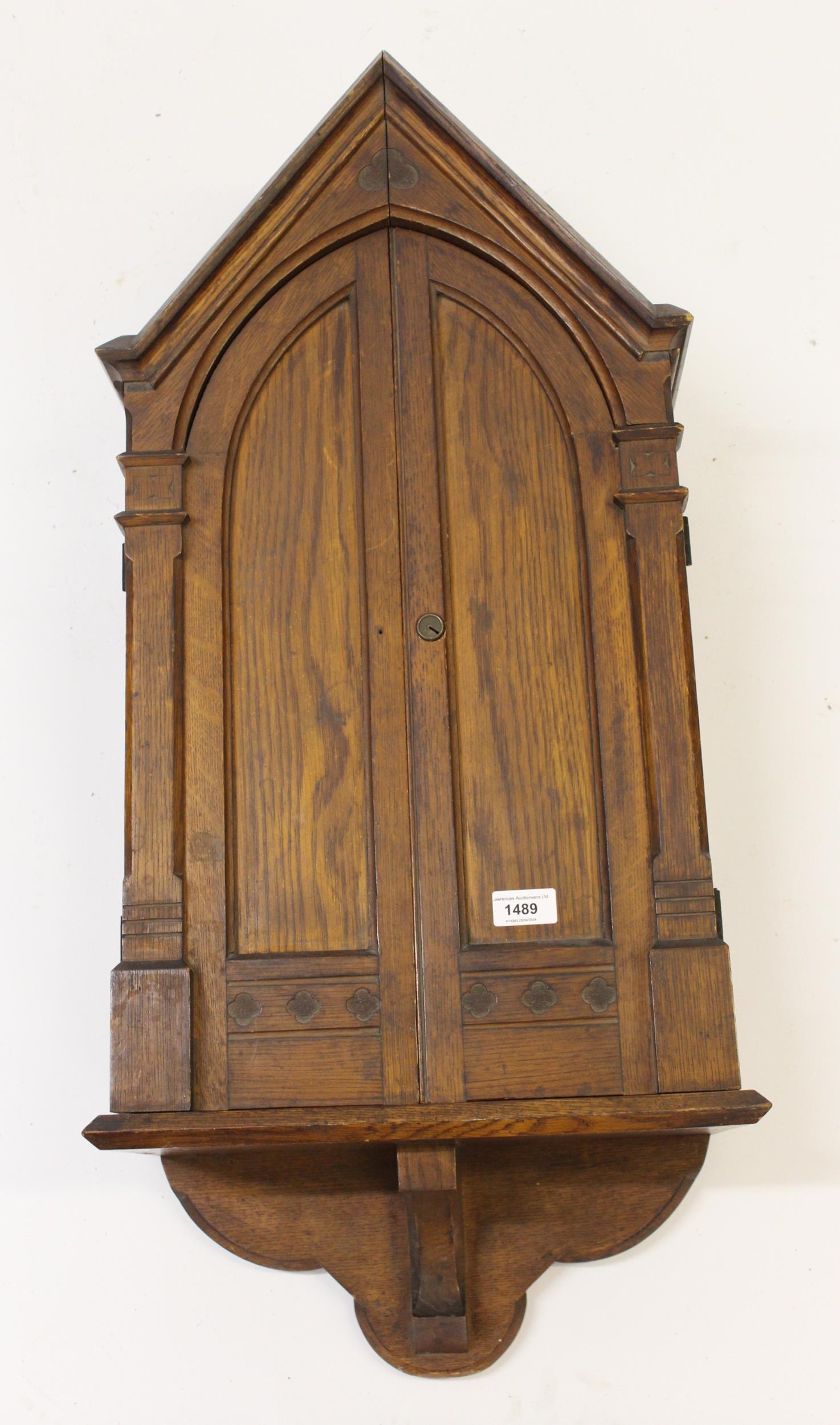 Late 19th Century oak Gothic style two door hanging cabinet, 40cm wide x 86cm high Good