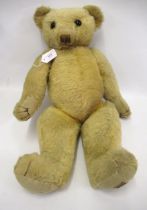 Antique Merrythought articulated plush teddy bear bearing original label, 64cm high (worn)