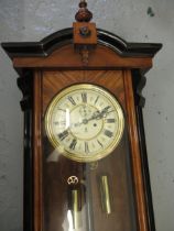 Late 19th Century Continental walnut and part ebonised Vienna style wall clock, the architectural