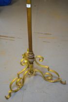 Late 19th / early 20th century brass adjustable standard lamp on scrolled supports (adjuster at