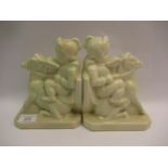 David Evans for Pilkington, pair of pottery bookends each in the form of a boy riding a donkey, 19cm