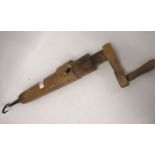 Unusual antique turned burr wood rope twisting arm, mounted with an iron hook, 66cm long