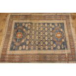 Kurdish rug in shades of blue and rust, 135 x 110cm, together with another similar rug, 116 x 84cm