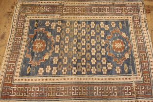 Kurdish rug in shades of blue and rust, 135 x 110cm, together with another similar rug, 116 x 84cm