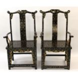 Two Chinese black lacquer and chinoiserie decorated throne chairs, 120cm high x 67cm wide x 50cm