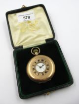 9ct Gold half hunter crown wind pocket watch, the enamel dial with Roman numerals and subsidiary
