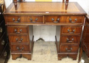 Reproduction mahogany twin pedestal desk with leather inset top and nine drawers, 77cm high x