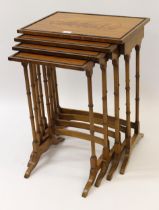 Nest of four rectangular satinwood occasional tables on slender turned supports with oval inlaid