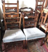 Set of six George III mahogany dining chairs, the pierced ladderbacks above stuffover seats and