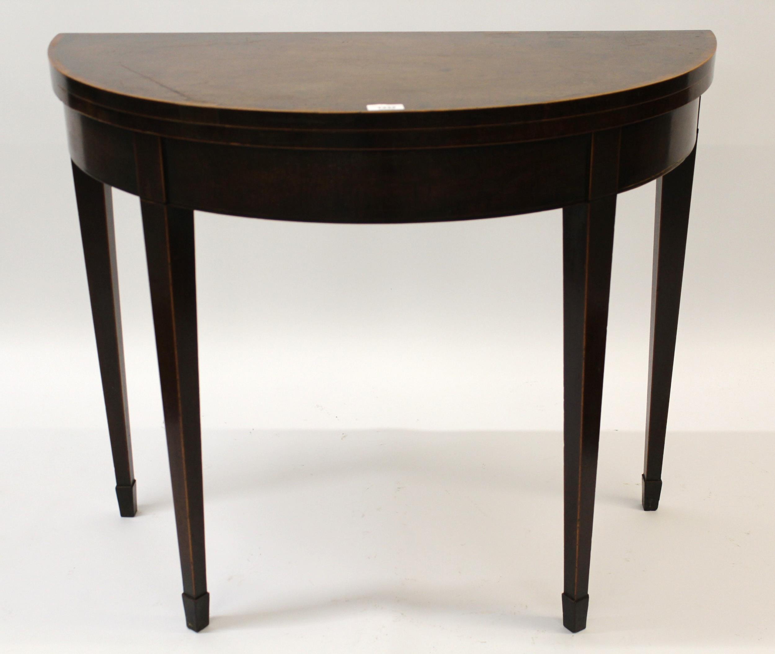 George III mahogany line inlaid demi lune fold-over card table on square tapering supports, 74cm