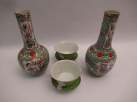 Pair of Chinese porcelain bottle vases decorated with birds and insects on a turquoise ground (one