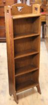 Arts and Crafts narrow bookcase with pierced decoration and shaped supports, possibly for Liberty,