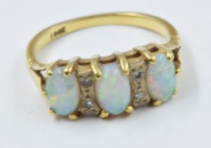 18ct Gold ring set three opals and four small diamond chips 3.2g in weight