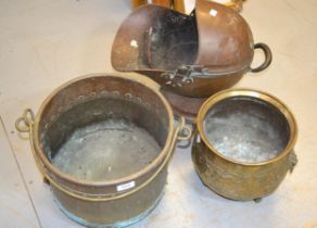 Brass and copper studded log basket, with swing handle and claw and ball supports, another brass