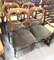 Set of four 19th Century mahogany balloon back side chairs having overstuffed seats, on turned