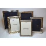 Group of four various silver photograph frames, together with another silver plated frame Smallest